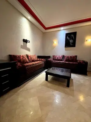 a living room with two couches and a coffee table at Votre chez-vous à Casa, une ambiance cosy garantie in Casablanca