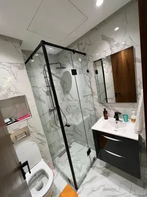 a bathroom with a shower and a toilet and a sink at Studio en plein centre de Casablanca in Casablanca