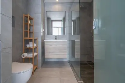 a bathroom with a toilet and a sink and a mirror at Studio Raffiné en Centre Ville in Casablanca