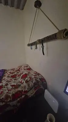 a bedroom with a bed and a lamp in it at Ferme Benslimane 30 min de rabat in O Ben Slimane