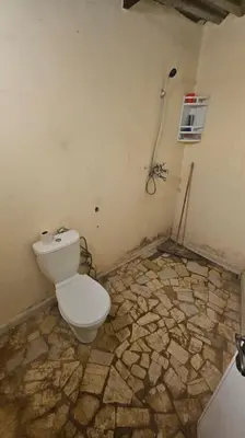 a bathroom with a toilet in a room at Ferme Benslimane 30 min de rabat in O Ben Slimane