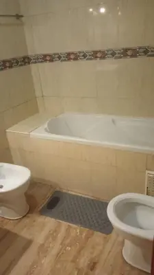 a bathroom with a bath tub and a toilet at Appartement à Maarif in Casablanca