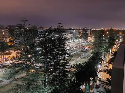 a city at night with a lot of traffic at Apparemment 300 m de la plage, Parc Mohammedia in Mohammedia