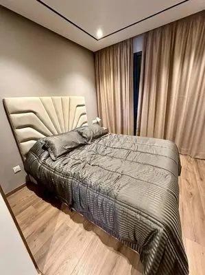 a bedroom with a bed in a room with a window at Studio pivoine 27 CFC à 2mn in Casablanca