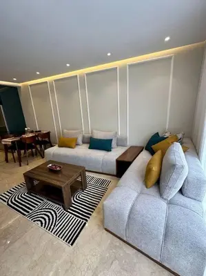 a living room with two couches and a coffee table at Studio pivoine 27 CFC à 2mn in Casablanca