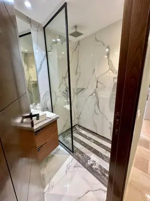 a bathroom with a walk in shower and a sink at Studio pivoine 27 CFC à 2mn in Casablanca