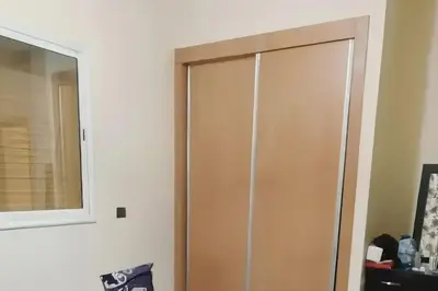 a closet door in a room with a mirror at appartement calme in Casablanca