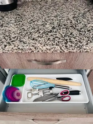 a drawer with scissors and other items in it at Havre de Confort Proche de Tout à 5 min de la Gare in Casablanca