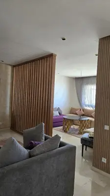 a living room with a couch and a table at Marina casablanca in Casablanca