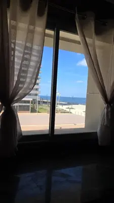 a window with a view of the beach from a room at Marina casablanca in Casablanca