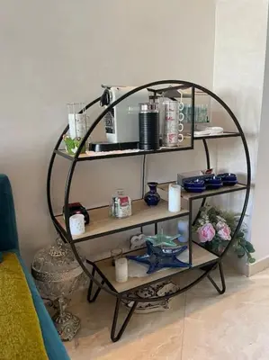 a room with a shelf with items on it at Appart avec Piscine Proche de la Mer in Bouznika