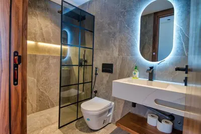 a bathroom with a toilet and a sink and a mirror at Prestigieux Studio- Vue dégagée in Casablanca