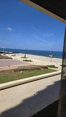 a view of a beach from a window at Casablanca marina in Casablanca