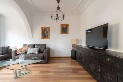 a living room with a couch and a flat screen tv at Appartement Cosy Proche du Stade in Rabat