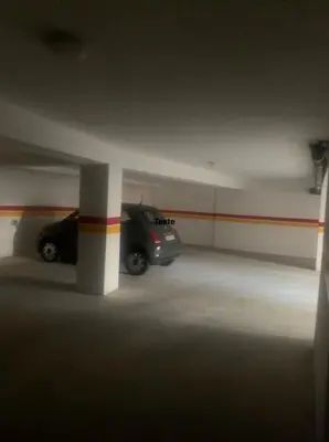 a parking garage with two cars parked in it at Cosy Aparts, 2BR, downtown, near tramway in Casablanca