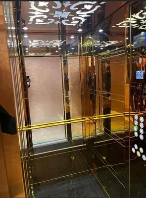 a glass elevator with a yellow tape around it at Cosy Aparts, 2BR, downtown, near tramway in Casablanca