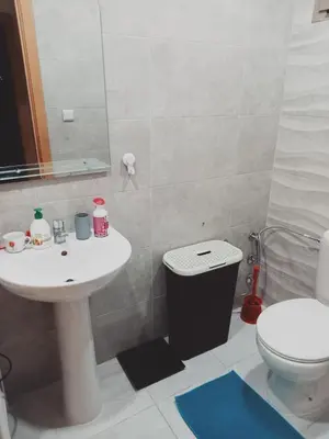 a bathroom with a sink and a toilet at Riad Ain Atiq in Temara