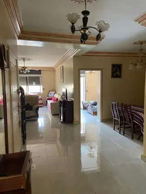 a living room with a couch and a table at Appartement Belevédère in Casablanca