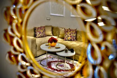 a reflection of a couch in a mirror at appartement luxe rabat ville in Rabat