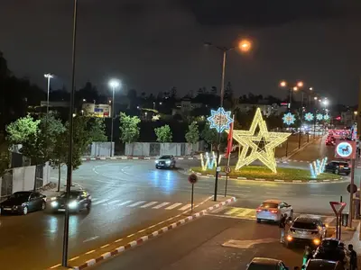 a city street at night with cars parked at Perfect for Families & Friends! King & Queen beds in Casablanca