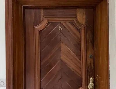 a brown wooden door with a wooden paneled door at Perfect for Families & Friends! King & Queen beds in Casablanca