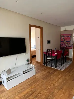 a living room with a flat screen tv on a wall at Oean view apartment Marina Casablanca in Casablanca