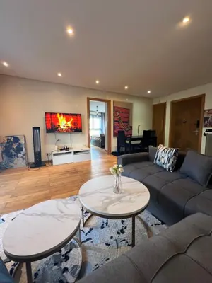 a living room with a couch and a table at Oean view apartment Marina Casablanca in Casablanca