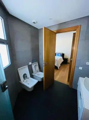 a bathroom with a toilet and a sink at Oean view apartment Marina Casablanca in Casablanca