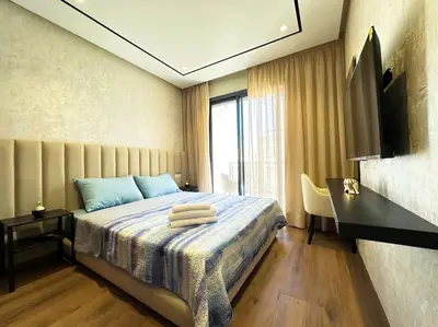 a bedroom with a bed with towels on it at Cozy Studio Calypso 10, CFC à 2min, Parking Dispo in Casablanca