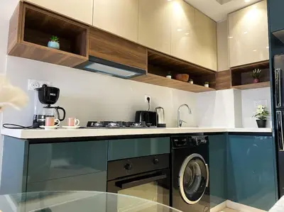 a kitchen with a washing machine in a kitchen at Cozy Studio Calypso 10, CFC à 2min, Parking Dispo in Casablanca