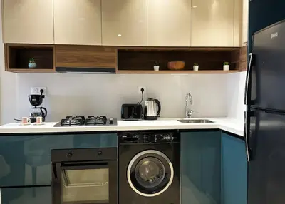a kitchen with a washer and a dishwasher at Cozy Studio Calypso 10, CFC à 2min, Parking Dispo in Casablanca