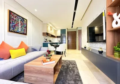 a living room with a couch and a table at Cozy Studio Calypso 10, CFC à 2min, Parking Dispo in Casablanca