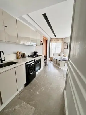 a kitchen with a washer and a sink and a stove at Central, confort & luxueux 1room - quartier Princesses in Casablanca