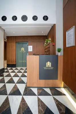 a lobby of a hotel with a reception desk at Central, confort & luxueux 1room - quartier Princesses in Casablanca