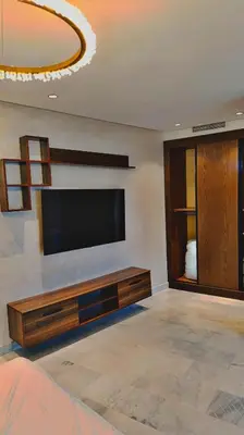 a living room with a flat screen tv on a wall at L'harmonie in Casablanca
