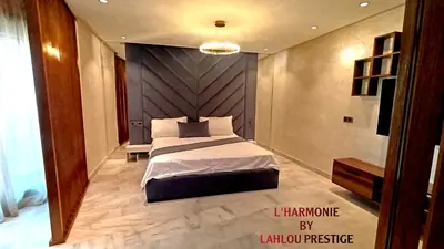 a bedroom with a large bed in a room at L'harmonie in Casablanca