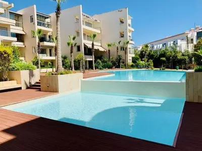 a large swimming pool in front of a building at Rock Island Haut standing in Mohammedia