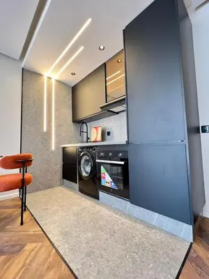 a kitchen with a washer and dryer in a room at Studio prague in Casablanca