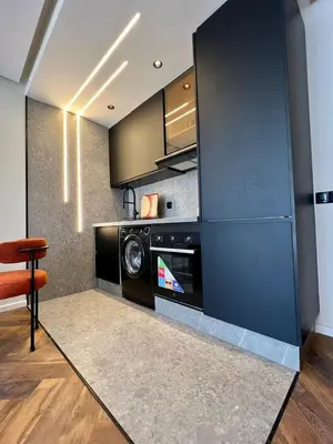 a kitchen with a washer and dryer in a room at Studio prague in Casablanca