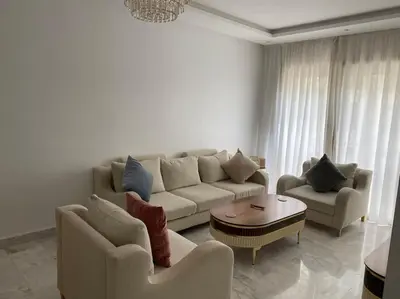 a living room with a couch and two chairs and a table at Apparemment Meuble a 5 min de l'aéroport casa in Nouaceur