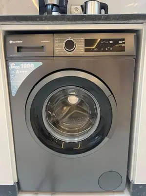 a washing machine with its door open in a room at Cozy appartement Rabat in Rabat