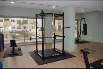 a gym with cardio equipment in a room at Studio Meuble a 5 min de l'aéroport Casablanca in Nouaceur