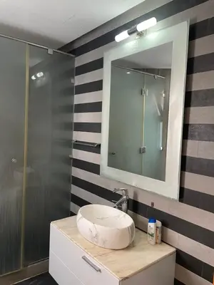 a bathroom with a sink and a mirror at Charming Seaview Apartment 4 in Casablanca
