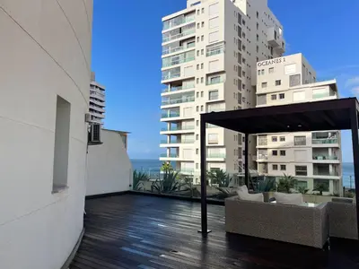a balcony of a building with a table and chairs at Charming Seaview Apartment 4 in Casablanca