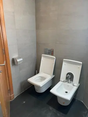a bathroom with a toilet and a sink at Charming Seaview Apartment 4 in Casablanca