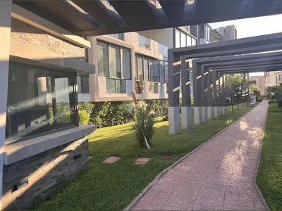 a building with a walkway in front of it at Les crêtes dar bouazza in Casablanca