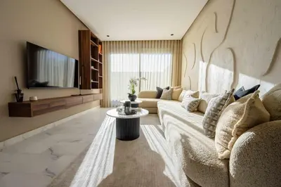 a living room with a couch and a tv at Luxe Modern Studio in Casablanca in Casablanca