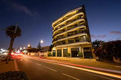 a tall building on a city street at night at Luxe Modern Studio in Casablanca in Casablanca