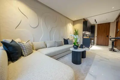 a living room with a couch and a table at Luxe Modern Studio in Casablanca in Casablanca