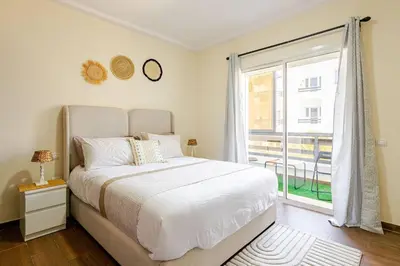 a bedroom with a bed and a large window at New! Appartement les pieds dans l'eau WELCOME STAY in Pont Blondin